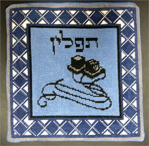 Photograph of finished needlepoint tefillin bag.